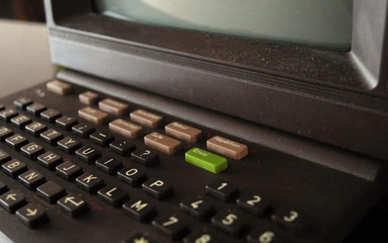 Close-up of a vintage Minitel terminal keyboard with a green Envoi key